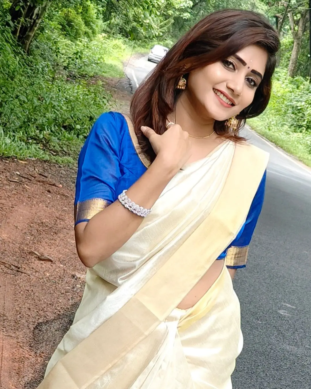 Vasanthi Krishnan Wearing Traditional White Saree Blue Blouse